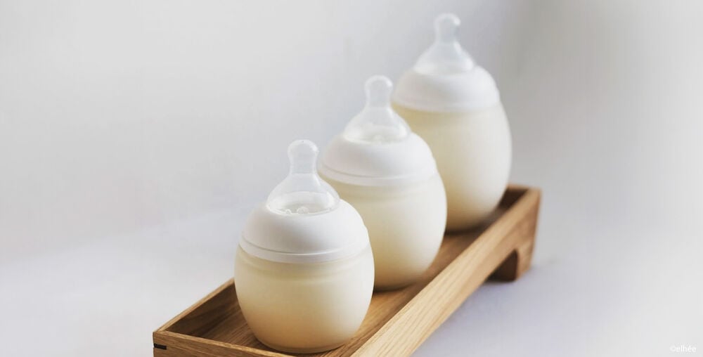 Chauffe-biberon nomade avec biberon prêt à servir, idéal pour chauffer le lait à la température idéale