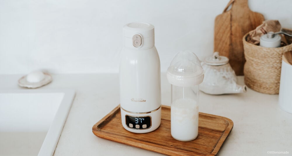 Chauffe-biberon nomade avec biberon prêt à servir, idéal pour chauffer le lait à la température idéale